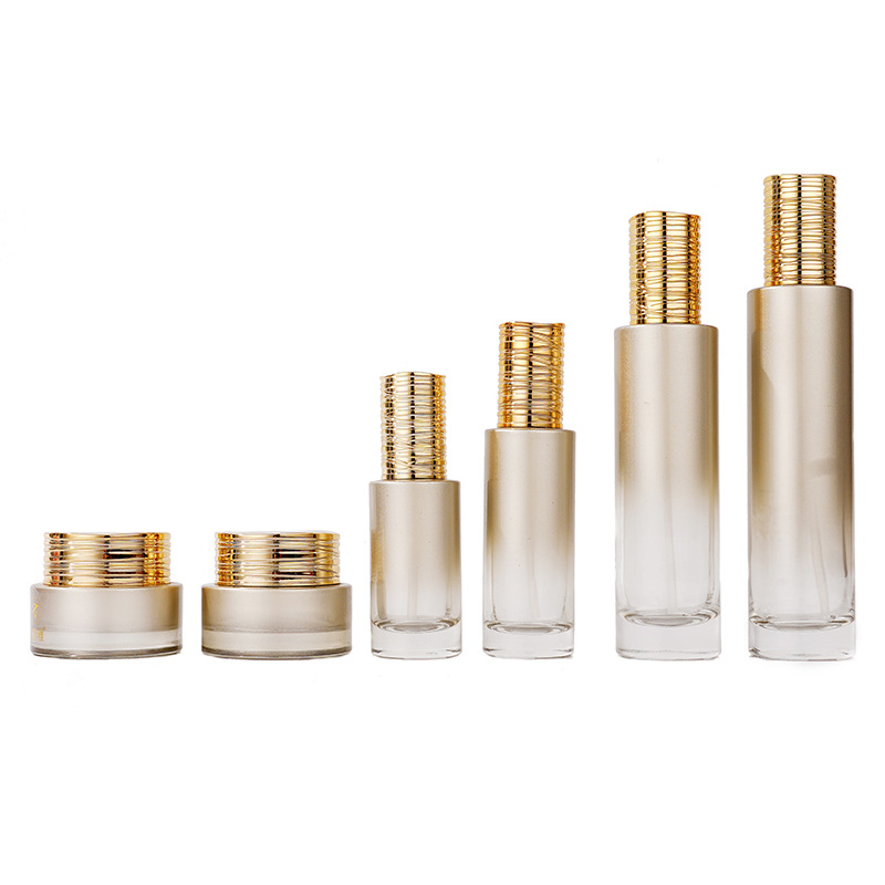 Szklana butelka na serum z galwanizowaną, szczotkowaną pokrywką Szklana butelka na serum z galwanizowaną, szczotkowaną pokrywką