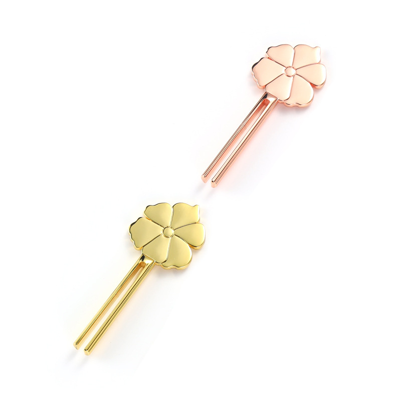 Wyciskacz do rurek ze stopu cynku w kształcie uśmiechniętego kwiatu Wyciskacz do rurek ze stopu cynku w kształcie uśmiechniętego kwiatu